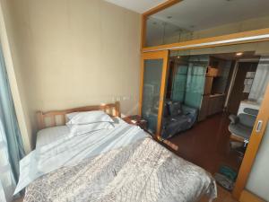 Postel nebo postele na pokoji v ubytování 上海加特奈斯新时空酒店中山公园店