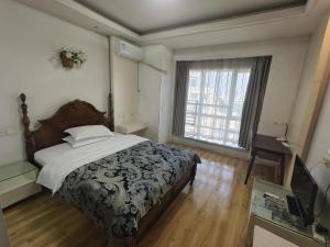 Postel nebo postele na pokoji v ubytování 上海加特奈斯新时空酒店中山公园店