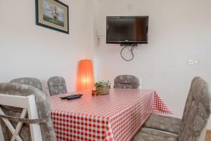TV a/nebo společenská místnost v ubytování Apartments Mili