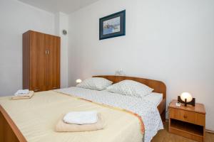Postel nebo postele na pokoji v ubytování Apartments Mili