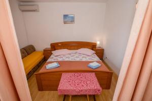 Postel nebo postele na pokoji v ubytování Apartments Mili