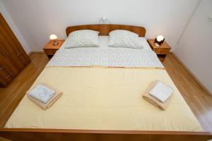 Postel nebo postele na pokoji v ubytování Apartments Mili
