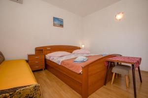 Postel nebo postele na pokoji v ubytování Apartments Mili