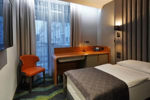 Voodi või voodid majutusasutuse HABAKUK Wellness & Event Hotel toas