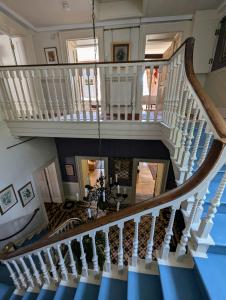 an overhead view of a staircase in a house at The Lawns House in Holt