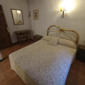 Postel nebo postele na pokoji v ubytování Apartaments Can Lo