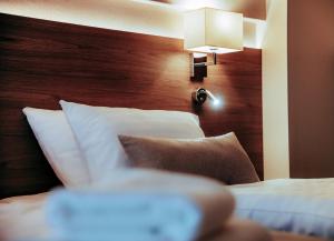 Postel nebo postele na pokoji v ubytování Hotel Piotr Spa&Wellness
