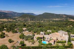 an aerial view of a house with a swimming pool at Villa - Sun and Moutain, Sa Murtera in Campanet