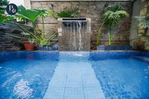 Bazén v ubytování Bali Puspa Guest House nebo v jeho okolí