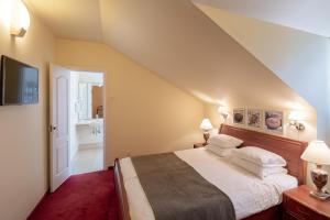 a bedroom with a large bed and a bathroom at Best Palanga Hotel in Palanga +18 photos
