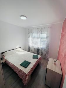 Ένα ή περισσότερα κρεβάτια σε δωμάτιο στο Apartament Gloria