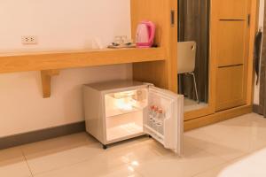 Kuchyň nebo kuchyňský kout v ubytování T Sleep Place Pattaya