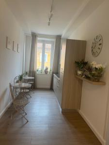 a hallway with a table and a clock on the wall at LINDA affittacamere in Ancona +31 photos