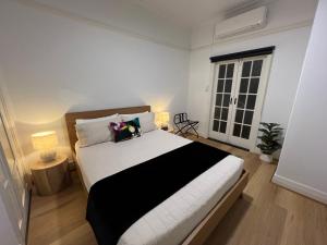 Postel nebo postele na pokoji v ubytování Sans Souci Apartments