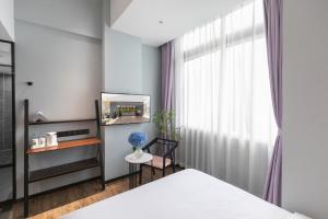 Postel nebo postele na pokoji v ubytování Spring Time Hotel