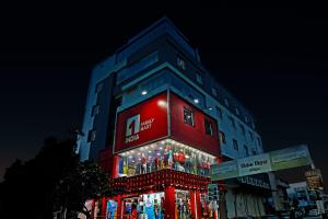 a building with christmas lights on the side of it at Townhouse Ranipur Mor in Haridwār