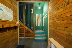 a hallway with wooden walls and stairs in a house at Liptov Lodge in Liptovský Mikuláš +32 photos