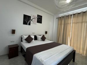Katil atau katil-katil dalam bilik di Nico Beach Hotel