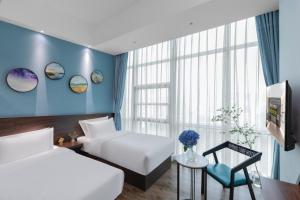 Postel nebo postele na pokoji v ubytování Spring Time Hotel