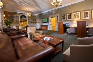 a living room with a couch and a table at Gideon Putnam Resort & Spa in Saratoga Springs