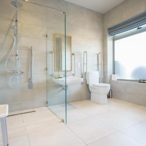 a bathroom with a shower and a toilet and a sink at Villa dei Venti in Qala