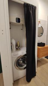 a laundry room with a washer and a washing machine at Casa vacanze Sirente Velino in Rocca di Mezzo