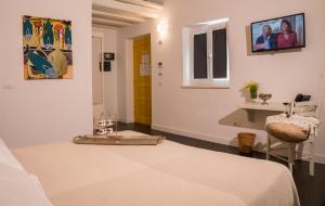 Postel nebo postele na pokoji v ubytování Boutique Hotel Molo S Lucia