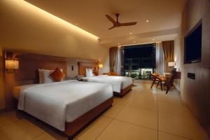 A bed or beds in a room at Elements by Rosetta