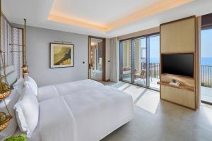 TV a/nebo společenská místnost v ubytování Mandarin Oriental, Muscat