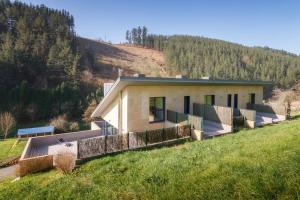 a house in the middle of a field at Beautiful townhouse 20km from Bilbao in Llodio