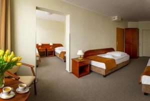 Posteľ alebo postele v izbe v ubytovaní Hotel Zawisza