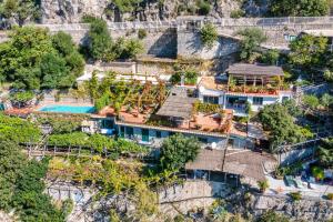 an aerial view of a house on a mountain at Luxury villa with swimming pool and access to the sea, Amalfi coast in Furore