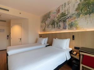 Ibis Singapore on Bencoolen - Newly Renovated客房内的一张或多张床位