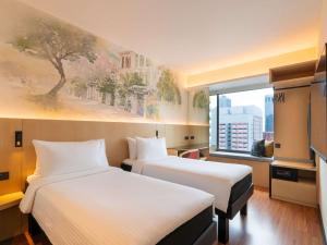Ibis Singapore on Bencoolen - Newly Renovated客房内的一张或多张床位