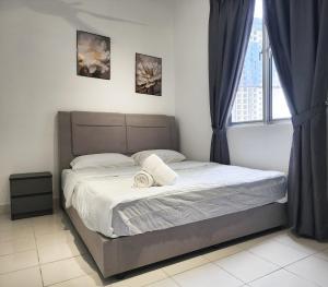 Ένα ή περισσότερα κρεβάτια σε δωμάτιο στο Malacca Spacious 3Bedroom Wifi Carpark +59 φωτογραφίες