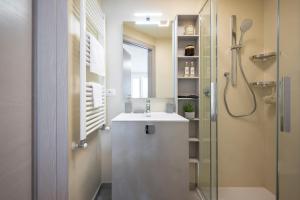 a bathroom with a sink and a shower at Apartment Il Giglio in Montelupo Fiorentino +7 photos