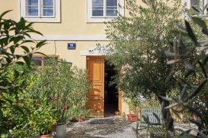 a door to a house with trees in front of it at Charles Bridge Apartments in Prague
