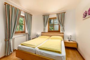 Posteľ alebo postele v izbe v ubytovaní Nussbaumerhof