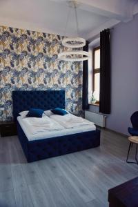 Łóżko lub łóżka w pokoju w obiekcie Legnicki Browar Książęcy Hotel i Restauracja