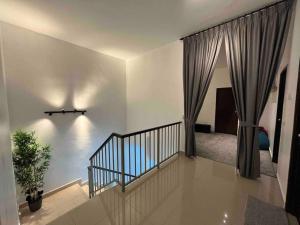 a room with a staircase leading to a bedroom at GioiaHome with 6 bedroom and 15 guest in Taiping