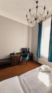 Łóżko lub łóżka w pokoju w obiekcie Legnicki Browar Książęcy Hotel i Restauracja