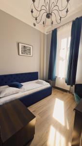 Łóżko lub łóżka w pokoju w obiekcie Legnicki Browar Książęcy Hotel i Restauracja