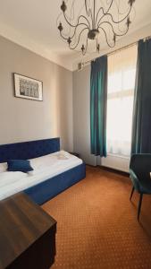 Łóżko lub łóżka w pokoju w obiekcie Legnicki Browar Książęcy Hotel i Restauracja