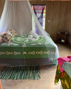 Letto o letti in una camera di Hei Maurua