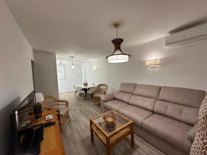 a living room with a couch and a table at Casa Bartolo in Murcia