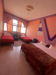 Postel nebo postele na pokoji v ubytování Taghadoute Hotel