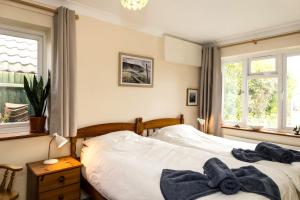 Postel nebo postele na pokoji v ubytování Coastal Hideaway in Pevensey Bay