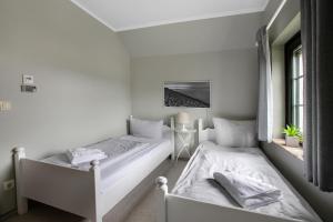 Postel nebo postele na pokoji v ubytování Ferienhaus Deichkönig