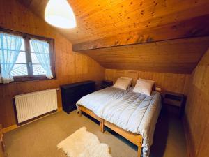 Postel nebo postele na pokoji v ubytování Chalet Gédéon