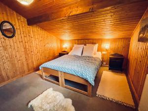Postel nebo postele na pokoji v ubytování Chalet Gédéon